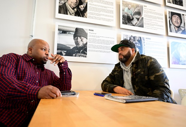 Jonathan Nelson, left, and Matthew Roberts talks at the From the Heart non-profit January 14 2023. Nelson shot Roberts at a party in 1998, spent time in prison for that crime and others, but the two have since become friends and are advocates for reducing gun violence and promoting forgiveness and healing. (Photo by Andy Cross/The Denver Post)